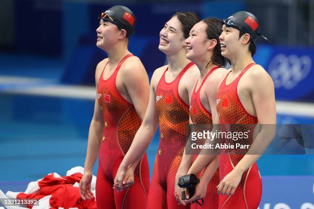 Junxuan Yang, Muhan Tang, Yufei Zhang and Li Bingjie of Team China celebrate after winning gold in the Women's 4X200 meter freestyle relay on day six...