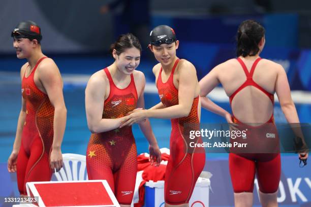 Junxuan Yang, Muhan Tang, Yufei Zhang and Li Bingjie of Team China celebrate after winning gold in the Women's 4X200 meter freestyle relay on day six...