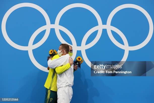 Silver medalist Kyle Chalmers of Team Australia hugs gold medalist Caeleb Dressel of Team United States after the medal ceremony for the Men's 100m...