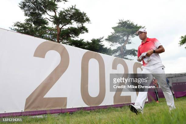 Hideki Matsuyama of Team Japan walks off the 18th hole during the first round of the Men's Individual Stroke Play on day six of the Tokyo 2020...