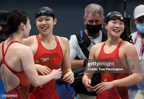 Yang Junxuan, Tang Muhan and Zhang Yufei of Team China celebrates winning gold in the Women's 4 x 200m Freestyle Relay Final on day six of the Tokyo...