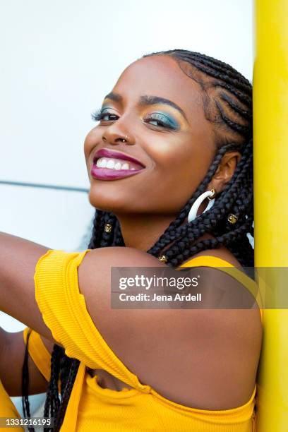 beautiful woman smiling, african american woman, black woman smiling and wearing colorful makeup - yellow eyeshadow stock pictures, royalty-free photos & images