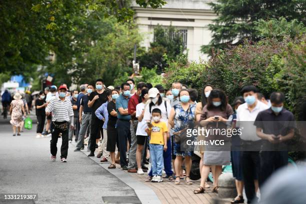 People line up for nucleic acid testing at a temporary Covid-19 testing center on July 29, 2021 in Nanjing, Jiangsu Province of China.