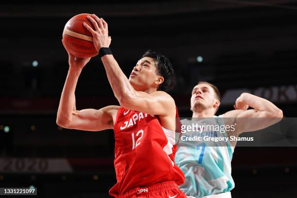 Yuta Watanabe of Team Japan goes up for a shot against Klemen Prepelic of Team Slovenia during the second half of a Men's Preliminary Round Group C...