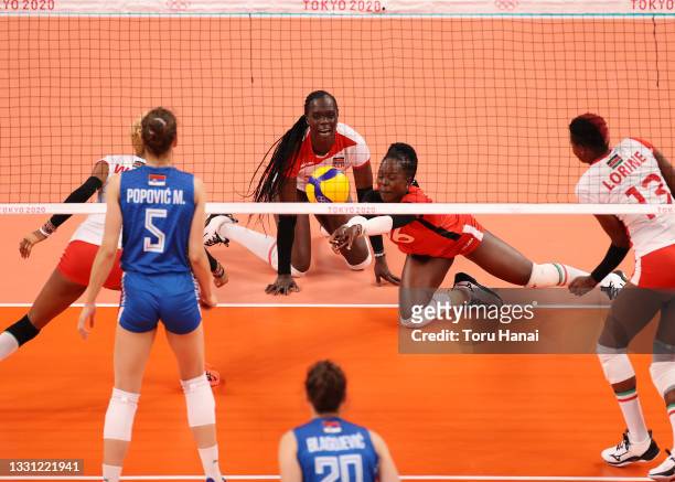 Agripina Khayesi Kundu of Team Kenya dives to return the ball against Team Serbia during the Women's Preliminary - Pool A volleyball on day six of...