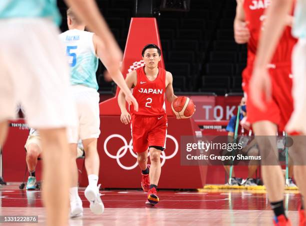 Yuki Togashi of Team Japan brings the ball up court against Slovenia during the second half of a Men's Preliminary Round Group C game on day six of...