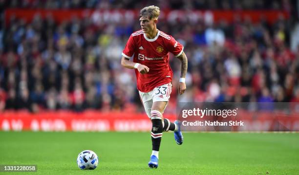 Brandon Williams of Manchester United runs with the ball during the pre-season friendly match between Manchester United and Brentford at Old Trafford...