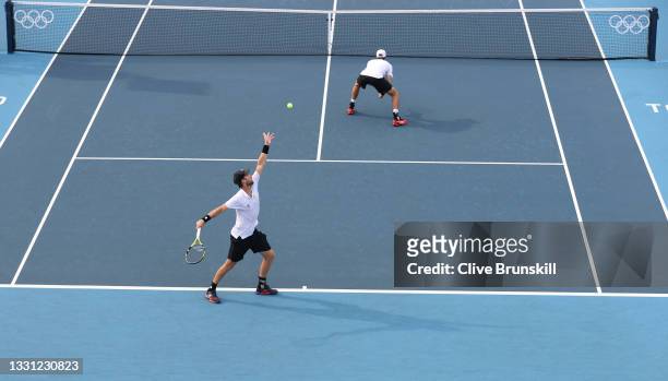 Michael Venus of Team New Zealand and Marcus Daniell of Team New Zealand play Ivan Dodig of Team Croatia and Marin Cilic of Team Croatia during their...