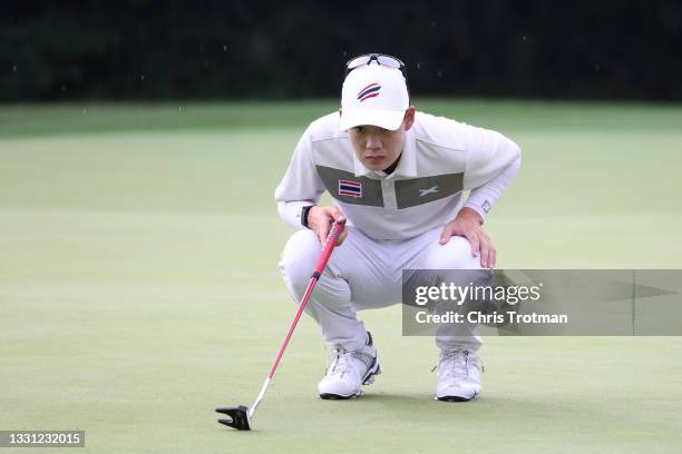 Jazz Janewattananond of Team Thailand lines up a putt on the 17th green during the first round of the Men's Individual Stroke Play on day six of the...