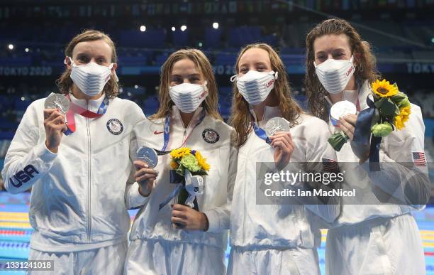 Silver medalists Allison Schmitt, Paige Madden, Katie McLaughlin and Katie Ledecky of Team United States celebrate during the medal ceremony for the...