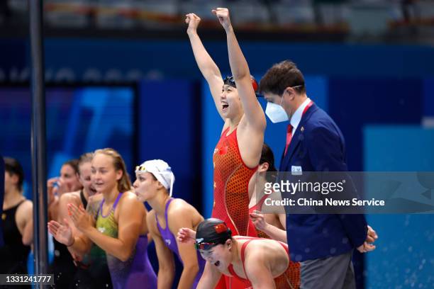 Yang Junxuan, Tang Muhan and Zhang Yufei of Team China celebrate after winning the Women's 4 x 200 m Freestyle Relay Final on day six of the Tokyo...