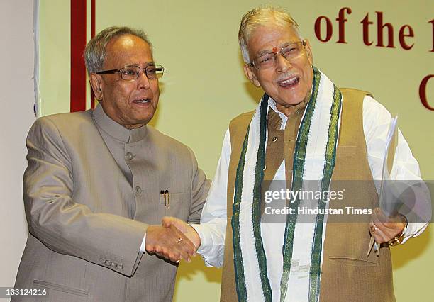 Union Finance Minister Pranab Mukherjee shakes the hand of Chairman of Public Accounts Committee Murli Manohar Joshi during the valedictory function...