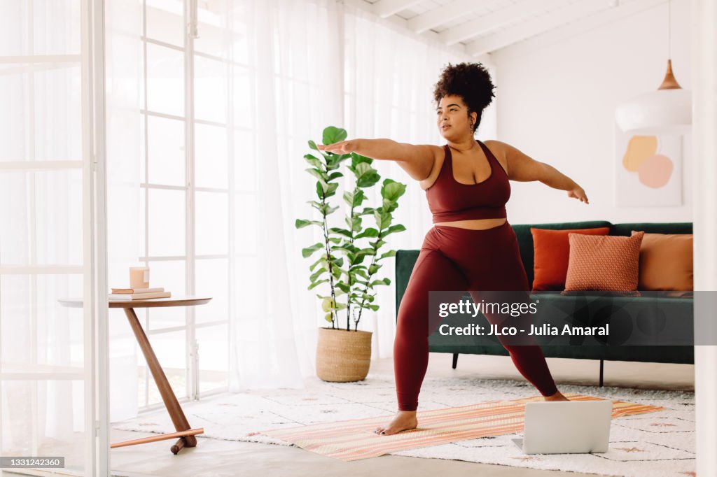 Healthy woman doing online workout