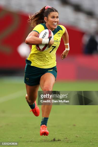 Charlotte Caslick of Team Australia breaks away to score a try in the Women’s pool C match between Team Australia and Team China during the Rugby...