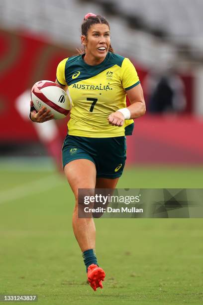 Charlotte Caslick of Team Australia breaks away to score a try in the Women’s pool C match between Team Australia and Team China during the Rugby...