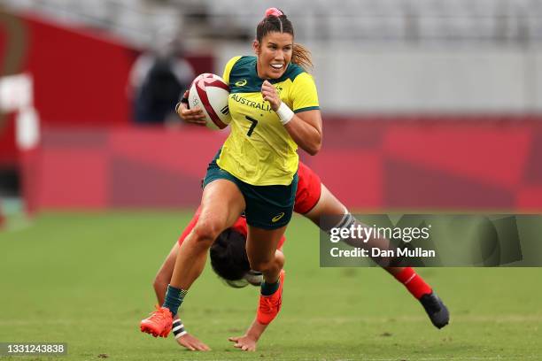 Charlotte Caslick of Team Australia breaks away to score a try in the Women’s pool C match between Team Australia and Team China during the Rugby...