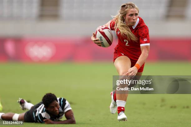 Kayla Moleschi of team Canada makes a break in the Women’s pool B match between Team France and Team Brazil during the Rugby Sevens on day six of the...