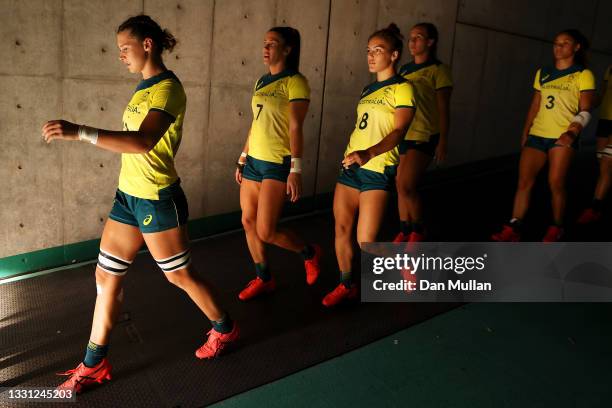 The Team Australia players prepare to take the field in the Women’s pool C match between Team Australia and Team China during the Rugby Sevens on day...