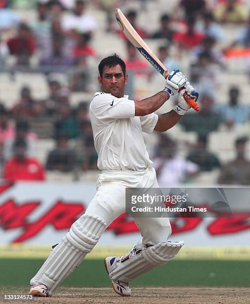Mahendra Singh Dhoni of India playing a shot during the second day of second Test Match between India and West Indies at Eden Gardens Stadium on...