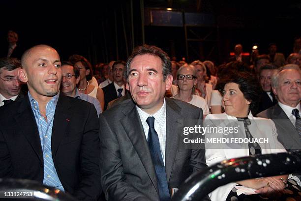 French leader of newly launched Democratic Movement party , Francois Bayrou , sits next to French judoka Djamel Bouras , Former ecology minister,...