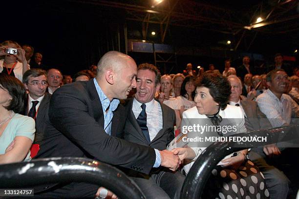 French leader of newly launched Democratic Movement party , Francois Bayrou , sits next to French judoka Djamel Bouras , Former ecology minister,...