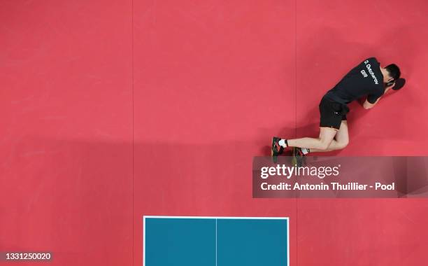 Dimitrij Ovtcharov of Team Germany lies on the floor after losing his Men's Singles Semifinals match on day six of the Tokyo 2020 Olympic Games at...