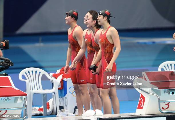 Junxuan Yang, Yufei Zhang, Bingjie Li and Muhan Tang of Team China celebrate the victory during the Women's 4 x 200m Freestyle Relay Final on day six...