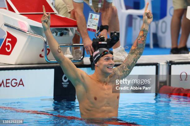 Caeleb Dressel of Team United States reacts after winning gold in the Men's 100 meter freestyle final on day six of the Tokyo 2020 Olympic Games at...