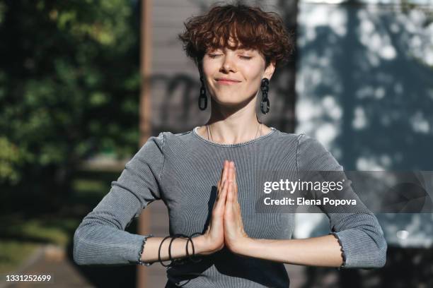 young confidence woman greeting her audience during live streaming - namaste bildbanksfoton och bilder