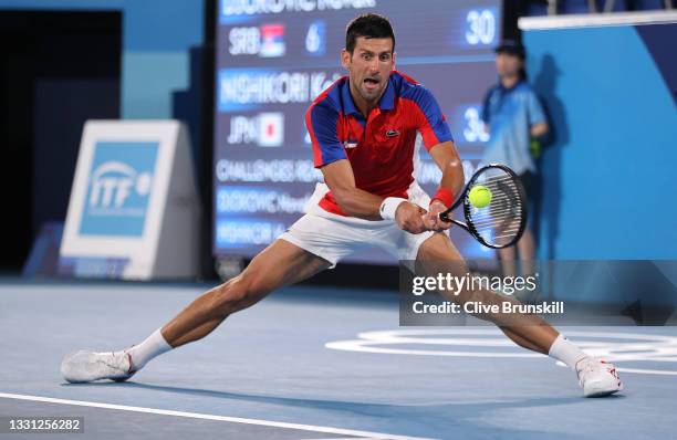 Novak Djokovic of Team Serbia plays a backhand during his Men's Singles Quarterfinal match against Kei Nishikori of Team Japan on day six of the...