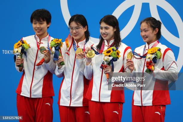 Junxuan Yang, Muhan Tang, Yufei Zhang and Bingjie Li of Team China pose with their medals after winning gold in the Women's 4X200 meter freestyle...