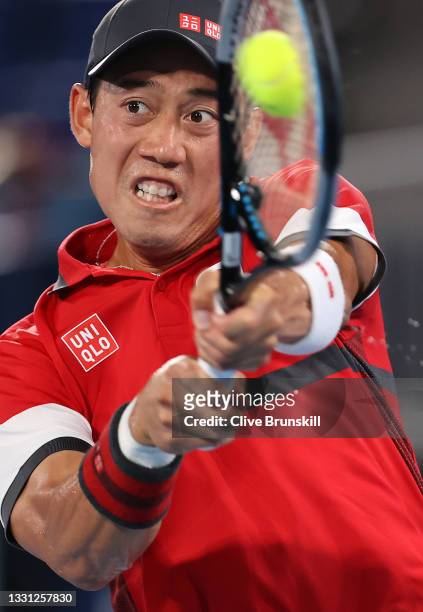 Kei Nishikori of Team Japan plays a backhand during his Men's Singles Quarterfinal match against Novak Djokovic of Team Serbia on day six of the...