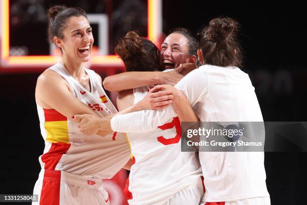 Team Spain forward Alba Torrens and point guard Maria Teresa Cazorla Medina celebrate with their teammates after defeating Serbia in a Women's...