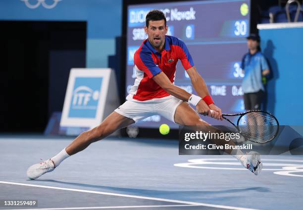 Novak Djokovic of Team Serbia plays a backhand during his Men's Singles Quarterfinal match against Kei Nishikori of Team Japan on day six of the...