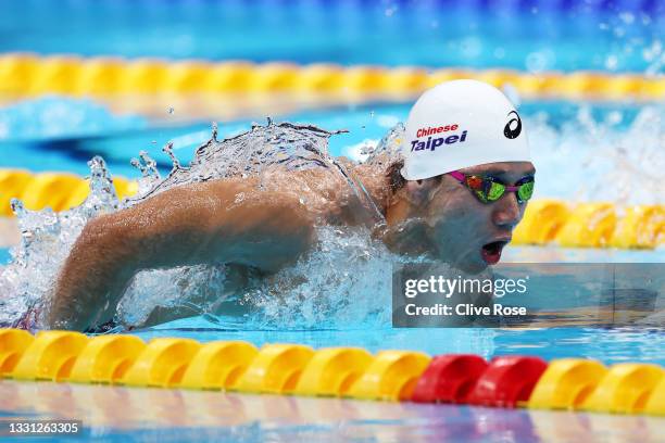 Kuan-Hung Wang of Team Chinese Taipei competes in the Men's 100m Butterfly heats on day six of the Tokyo 2020 Olympic Games at Tokyo Aquatics Centre...