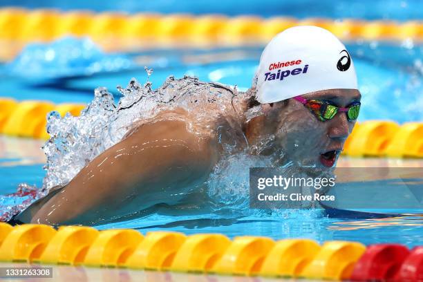 Kuan-Hung Wang of Team Chinese Taipei competes in the Men's 100m Butterfly heats on day six of the Tokyo 2020 Olympic Games at Tokyo Aquatics Centre...