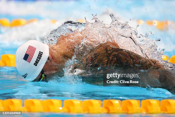 Caeleb Dressel of Team United States competes in the Men's 100m Butterfly heats on day six of the Tokyo 2020 Olympic Games at Tokyo Aquatics Centre...