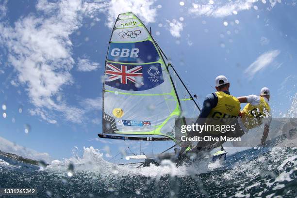 Dylan Fletcher and Stuart Bithell of Team Great Britain head out onto the water to compete in the Men's Skiff 49er class on day six of the Tokyo 2020...