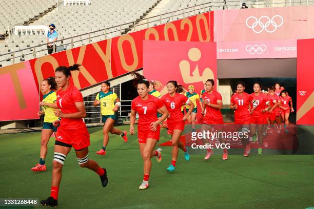Players of Team China walk into the Tokyo Stadium before the Rugby Sevens Women's Pool C match between Team Australia and Team China on day six of...