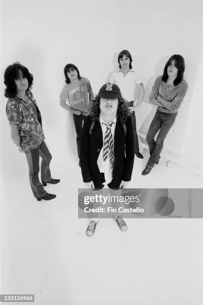 Australian rock band AC/DC posed in a studio in London in August 1979. Left to right: Bon Scott, Malcolm Young, Angus Young, Phil Rudd and Cliff...