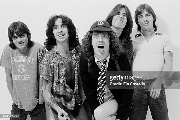 Australian rock band AC/DC posed in a studio in London in August 1979. Left to right: Malcolm Young, Bon Scott, Angus Young, Cliff Williams and Phil...