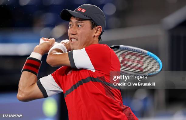 Kei Nishikori of Team Japan plays a backhand during his Men's Singles Quarterfinal match against Novak Djokovic of Team Serbia on day six of the...