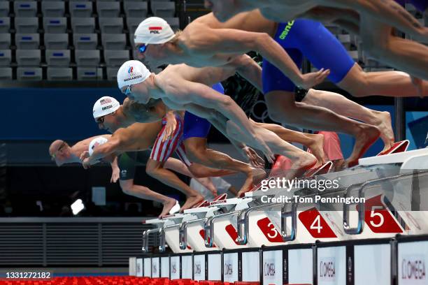 Caeleb Dressel of Team United States competes in the Men's 100m Butterfly heats on day six of the Tokyo 2020 Olympic Games at Tokyo Aquatics Centre...