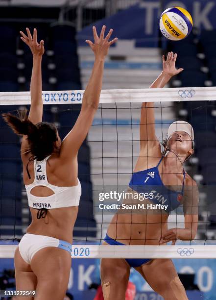 Fan Wang of Team China returns a shot against Ana Gallay and Fernanda Pereyra of Team Argentina during the Women's Preliminary - Pool C on day six of...