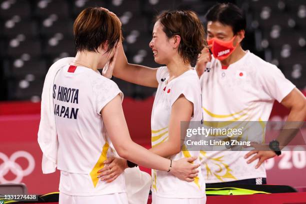 Yuki Fukushima comforts partner Sayaka Hirota of Team Japan after being defeated by Chen Qing Chen and Jia Yi Fan of Team China during a Women’s...