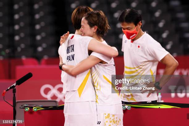 Yuki Fukushima comforts partner Sayaka Hirota of Team Japan after being defeated by Chen Qing Chen and Jia Yi Fan of Team China during a Women’s...