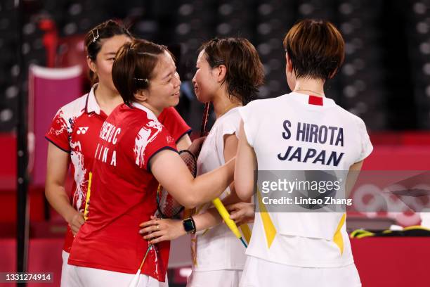 Yuki Fukushima and Sayaka Hirota of Team Japan greet opponents Chen Qing Chen and Jia Yi Fan of Team China after a Women’s Doubles Quarterfinal match...