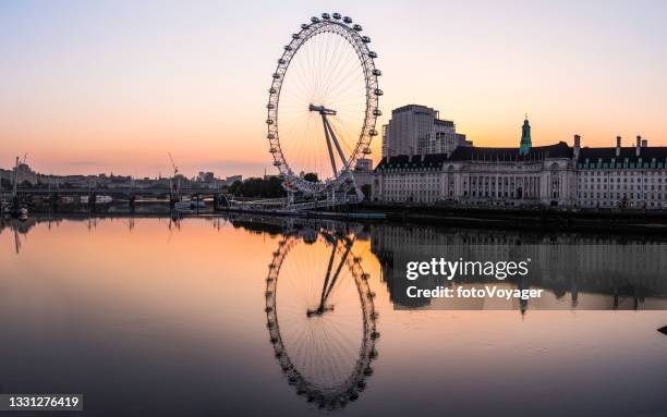 london eye ferris wheel reflecting in thames southbank sunrise panorama - millennium wheel stock pictures, royalty-free photos & images