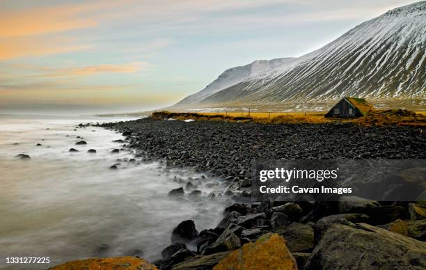 shed by the coast of skagafjordur fjord in north iceland - skagafjordur stock pictures, royalty-free photos & images