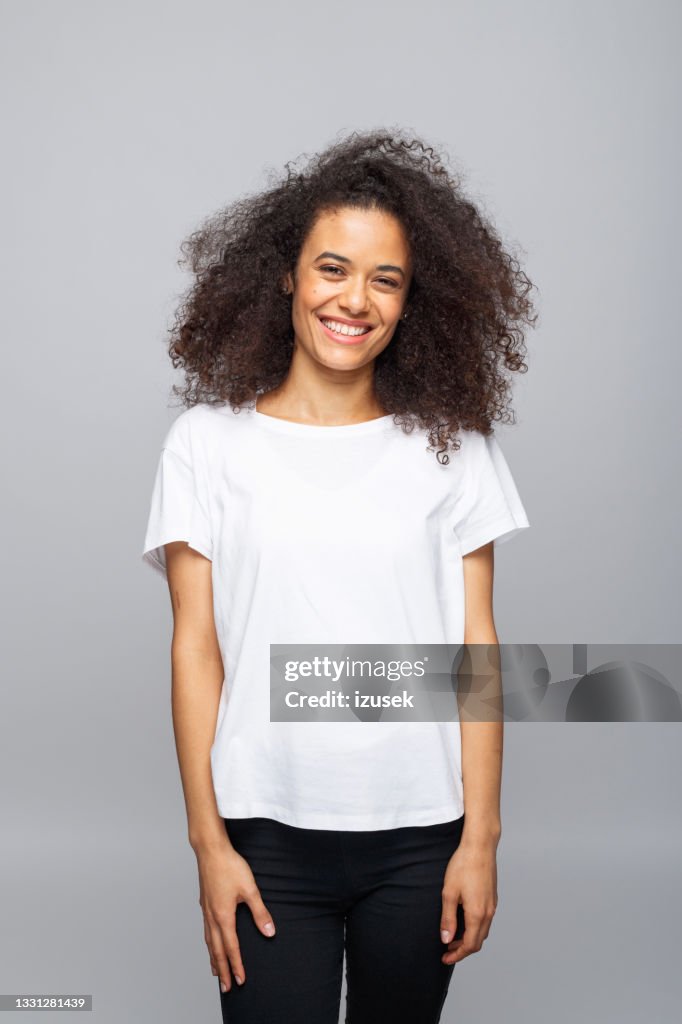 Cheerful young woman in white t-shirt
